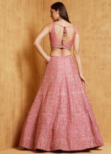 Traditional pink embroidered satin lehenga wedding wear back view