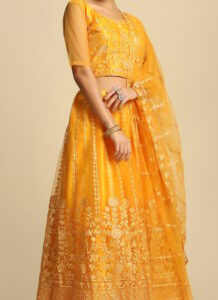 Sunshine yellow net embroidered A-line lehenga set side view