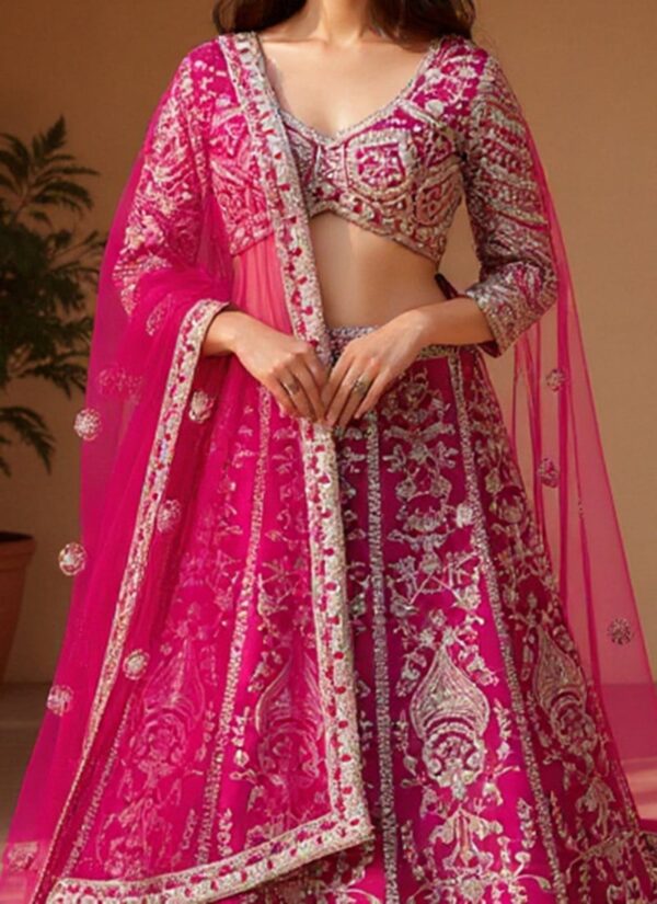 Pink festive net umbrella-cut lehenga choli with embroidered dupatta closeup view
