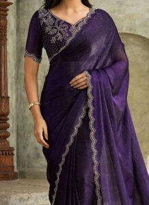 Violet faux chiffon saree with stone-embellished border closeup view